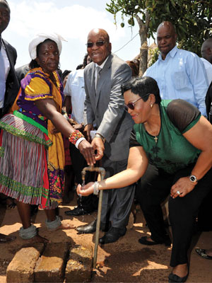 President Jacob Zuma and Water and Sanitation Minister Nomvula Mokonyane with Emily Sambo, from Bonwami village, who now has running water in her yard.