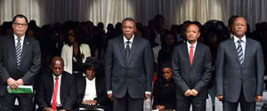 Minister in The Presidency Jeff Radebe (far right), KZN Premier Senzo Mchunu (second from right), Orlando Pirates Chairman Irvin Khoza and SAFA President Danny Jordaan with the late Senzo Meyiwa's family during the funeral.