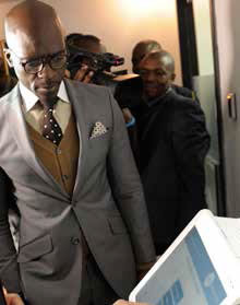 Home Affairs Minister Malusi Gigaba inspects the new Live Capture system used in processing of Smart ID Cards.