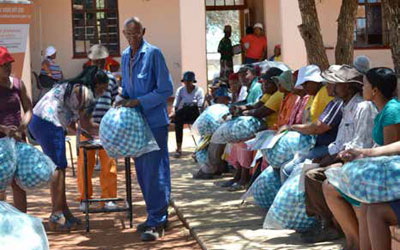 Community members receiving renewable energy products.