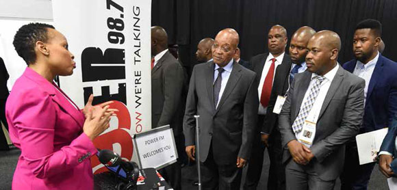 President Jacob Zuma, Trade and Industry Deputy Minister Mzwandile Masina, Gauteng MEC Lebogang Maile learn more about blackowned radio station PowerFM during the Black Industrial Indaba.