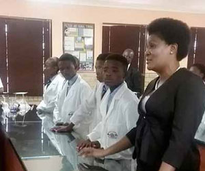 North West Education MEC Wendy Matsemela with learners from Boithaopo Secondary School in their new science lab.