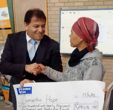 Maintenance beneficiary Samantha Hope received her maintenance payout cheque from Western Cape regional head, Advocate Hishaam Mohamed.