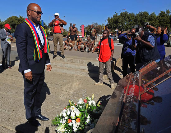 Arts and Culture Minister Nathi Mthethwa lays a wreath at the Hector Pieterson Square in Soweto.