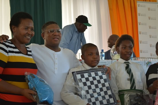 Minister Fikile Mbalula with recipients of the sport equipment handed over at the department’s outreach programme.