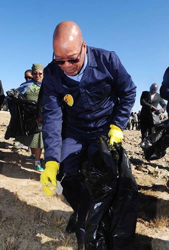 President Jacob Zuma cleaning the streets of Mvezo in the Eastern Cape as part of the previous Nelson Mandela International Day activities.