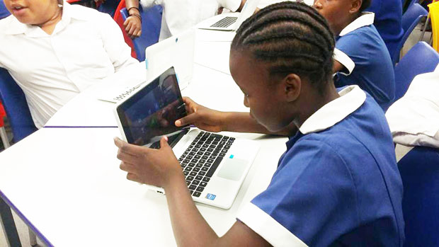 A learner explores technology at Bophelong Secondary School.