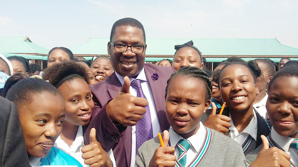 Gauteng Education MEC Panyaza Lesufi with learners from Bophelong Secondary School. The school offers learners smart classrooms and sport facilities.