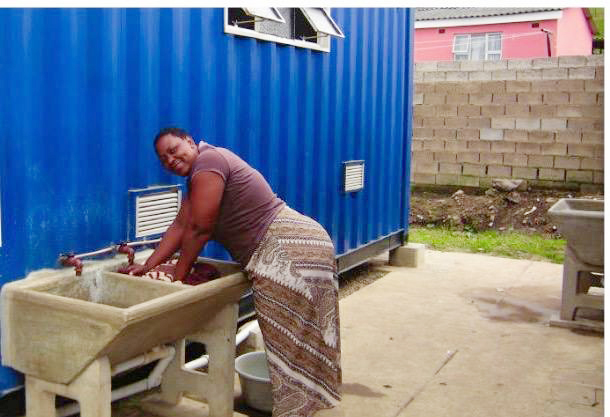 A resident makes use of a motorised water tanker.