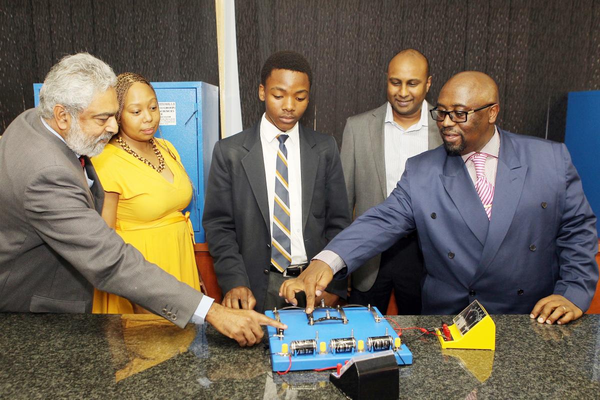 From left: Mahalingam Padayachee, principal of Reunion Secondary School, Ms Mbali Thusi, Director of Information Technology at the KwaZulu-Natal Department of Education; Thabani Jali, a pupil of Reunion Secondary School; Wayne Simon, Mondi Merebank Operations Manager; and Leonard Mbokazi, Mondi CSI Manager.