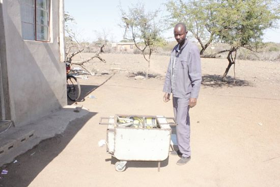 Themba Mthembu with the engine he invented.