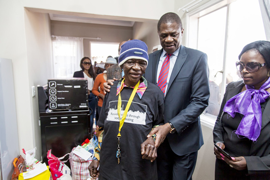 Gauteng MEC for Human Settlements Paul Mashatile with a housing beneficiary at Savana City Housing project in Sedibeng District Municipality.