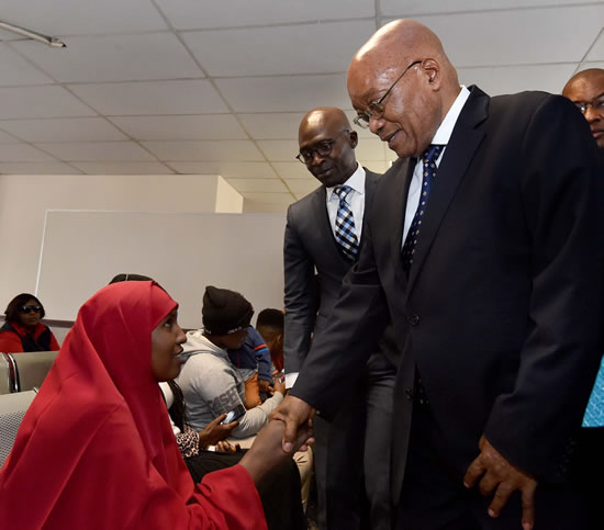 President Zuma with the former Minister of Home Affairs Malusi Gigaba greet refugees during the tour of the revamped premises.