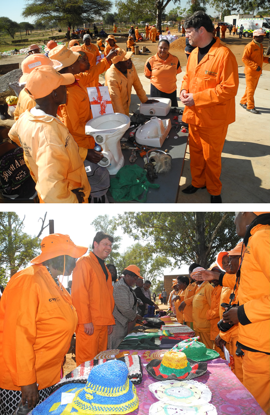 The Erasmus Community showcasing its crafts and materials to Deputy Minister of Cooperative Governance Andries Nel as part of the Community Work Programme.