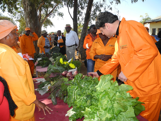 Deputy Minister of Cooperative Governance Andries Nel with vegetables produced at the Erasmus vegetable garden.