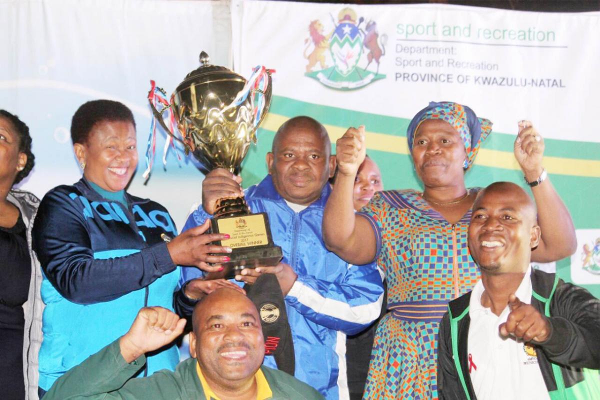 The champions of the KwaZulu-Natal Indigenous Games show off their trophy.