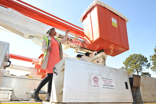 Fortunate Mdanda with a drilling rig manufactured by Smith Capital. The drill is used mostly by mining companies to drill big holes underground.