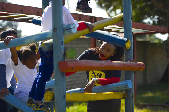 Deputy Minister Tandi Mahambehlala with youngsters from the New Jerusalem Children’s Home in Midrand. (Photo: GCIS)