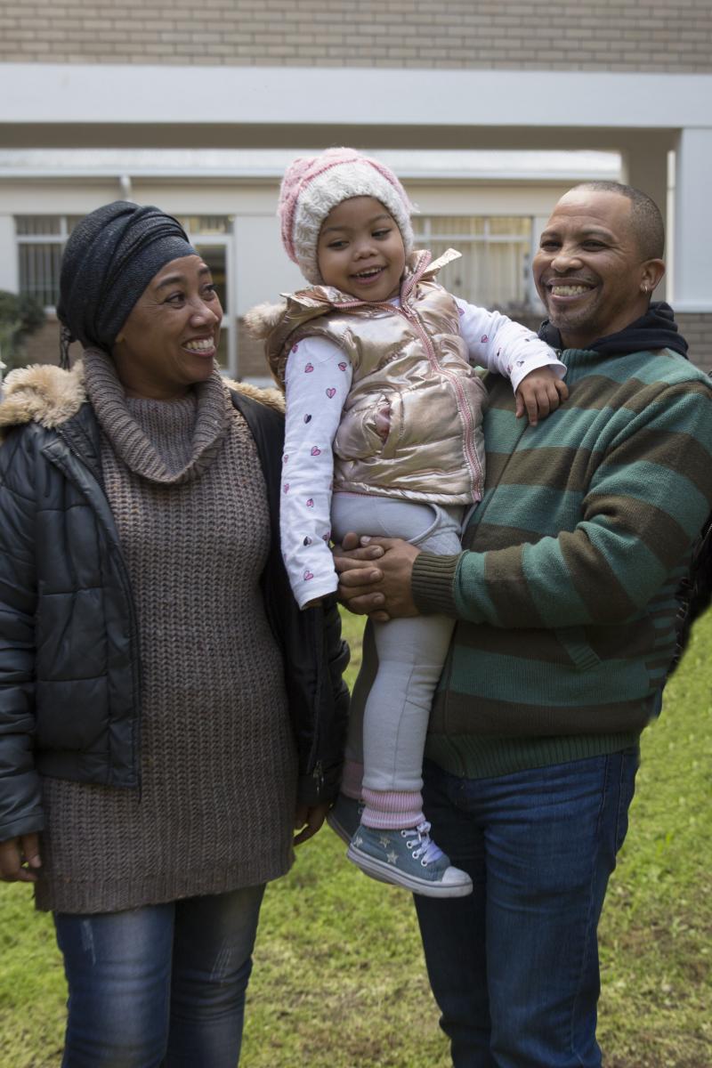 It is smiles all the way for two-year-old surgery recipient Zahrane Lewin pictured with her parents Yolanda and Esou.