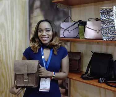 Textile designer and businesswoman Nthabi Lephoko with one of the leather bags she designed. Lephoko owns Leratolethato, a leather design and manufacturing company based in Cape Town.
