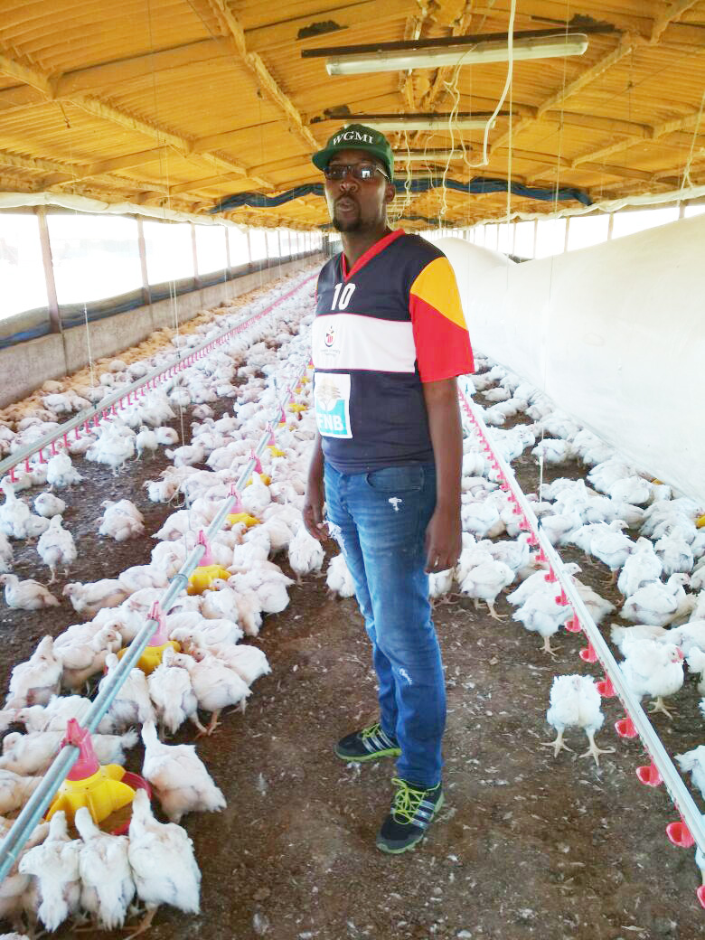Thabang Mokwele in a broiler house at his farm.