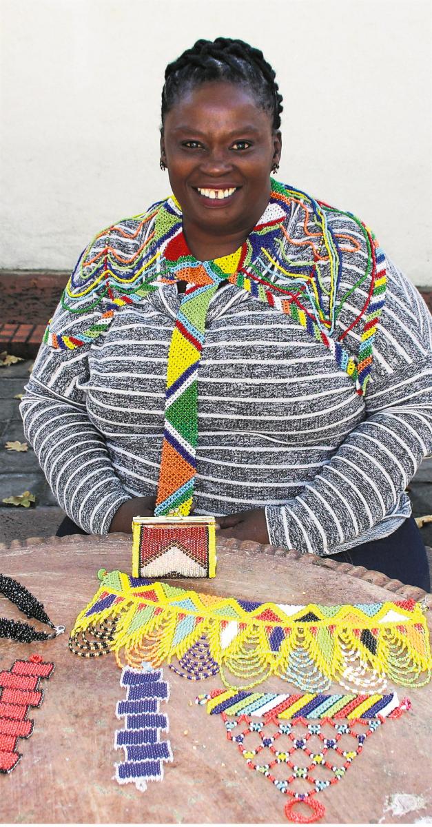Yolisa Fuma wearing some of the beadwork that she produces.