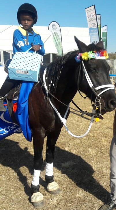 Anothe Buthelezi riding Blackberry after the Dundee July horse racing event.