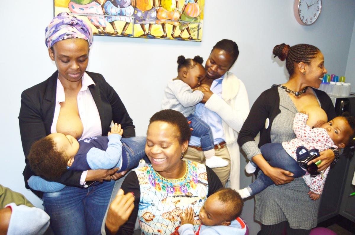 Limpopo Health MEC Dr Phophi Ramathuba (seated) flanked by breastfeeding mothers who came to the launch.