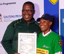 Gauteng MEC Panyaza Lesufi hands over a learner’s licence certificate to one of the pupils who benefitted from the K53 learner's licences programme.