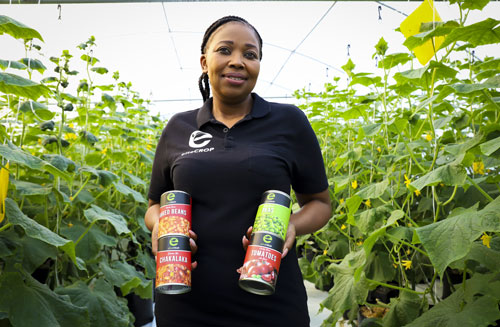  Hydroponic fruit and vegetable farmer Ntando Thabethe with some of her canned vegetables.