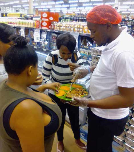 The founder of Monate Seasoning Spices, Pitso Mototo, with his products.