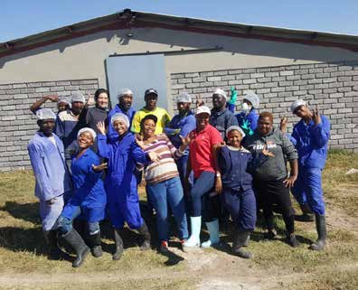 Students and staff from the Temaretha Agricultural Training School which is run by Mampe Mmeregi (on the right).