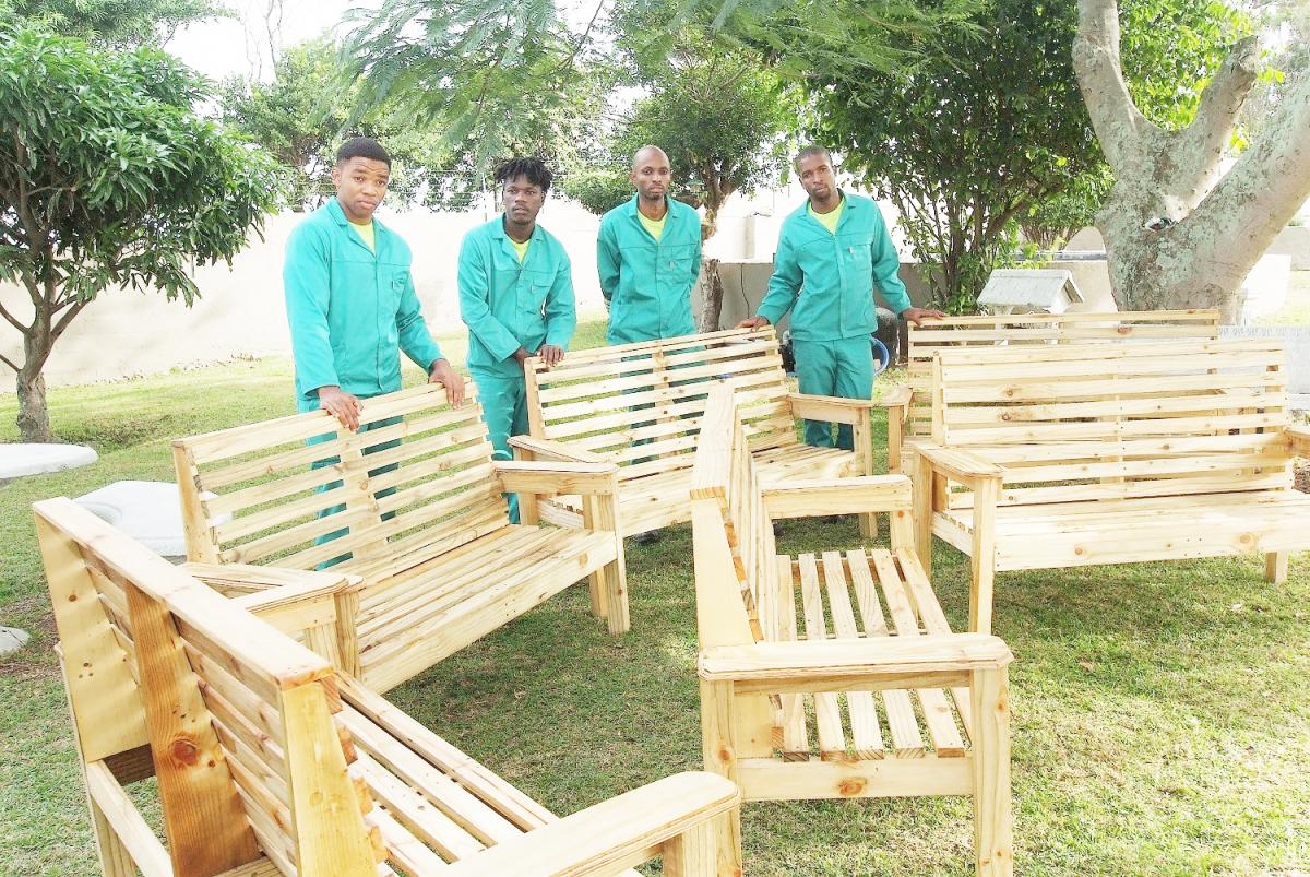 A group of trainees at the Sappi Skills Centre showing off some of the products which they made in their carpentry training. From left Siphelele Mthembu, Mduduzi Doncabe, Rony Mseleku and Halalisa Cele.