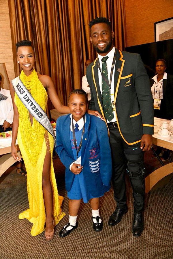 Springbok Captain Siya Kolisi and Miss Universe Zozibini Tunzi sharing a moment with Sinoyolo Qumba who was invited to help edit President Ramaphosa’s 2020 State of the Nation Address.