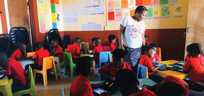 Learners from the Isiphosethu ECD centre using their tablets.