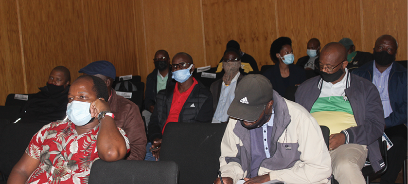 Men in Mogale City participate in the Under-the-Tree Dialogue aimed at tackling GBVF.