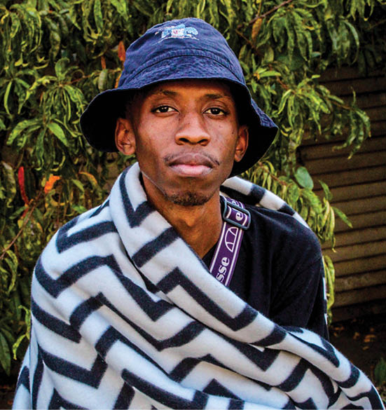 Oarabile Mashigo wrapped up in one of his blankets.