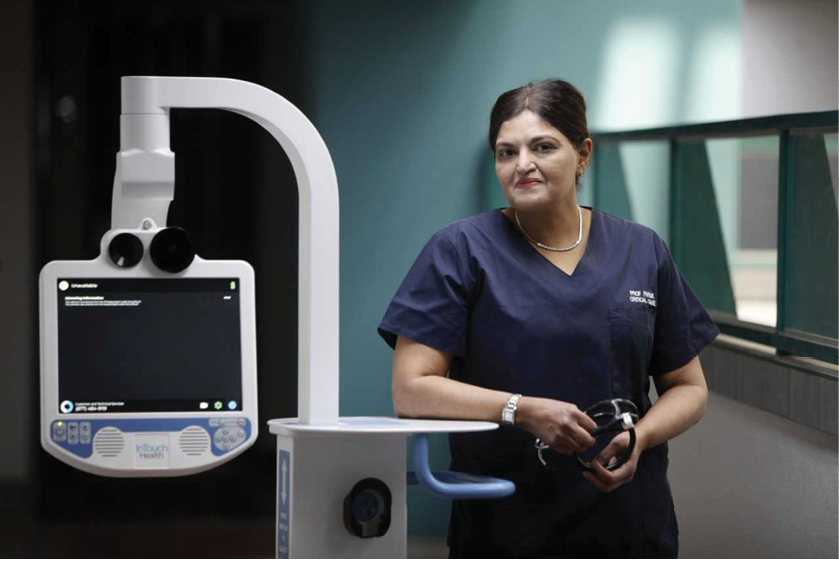 Prof Fathima Paruk, Academic and Clinical Head, of the Department of Critical Care at UP and Steve Biko Academic Hospital with mobile robot Stevie.