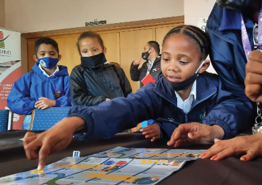 Jaywin Kustoor, Brooklyn Afrika and Shunay Wher playing the new COVID-19 awareness game.