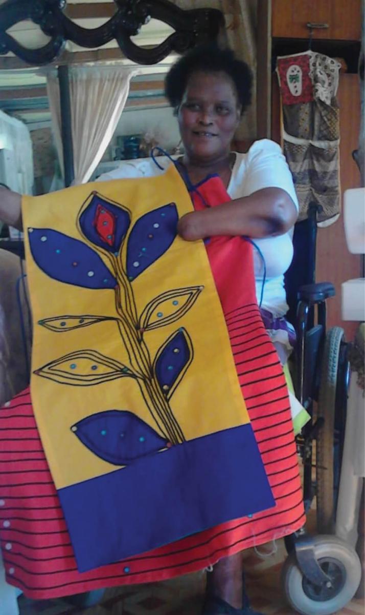 Bolekwa Salusalu makes a living from sewing, despite losing three limbs.