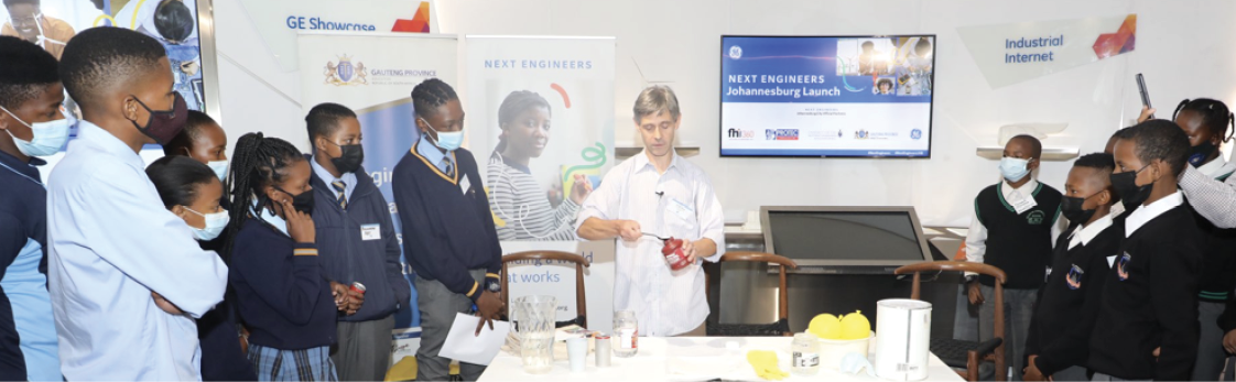 Senior Technician Officer Dylan Busa showing pupils some of the engineering materials they will be learning about.