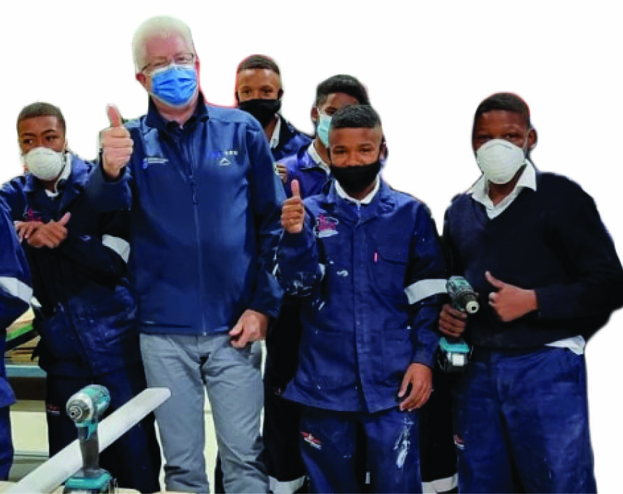 Western Cape Premier Alan Winde, with learners from the new skills facility who will now gain new knowledge in civil maintenance and food production.