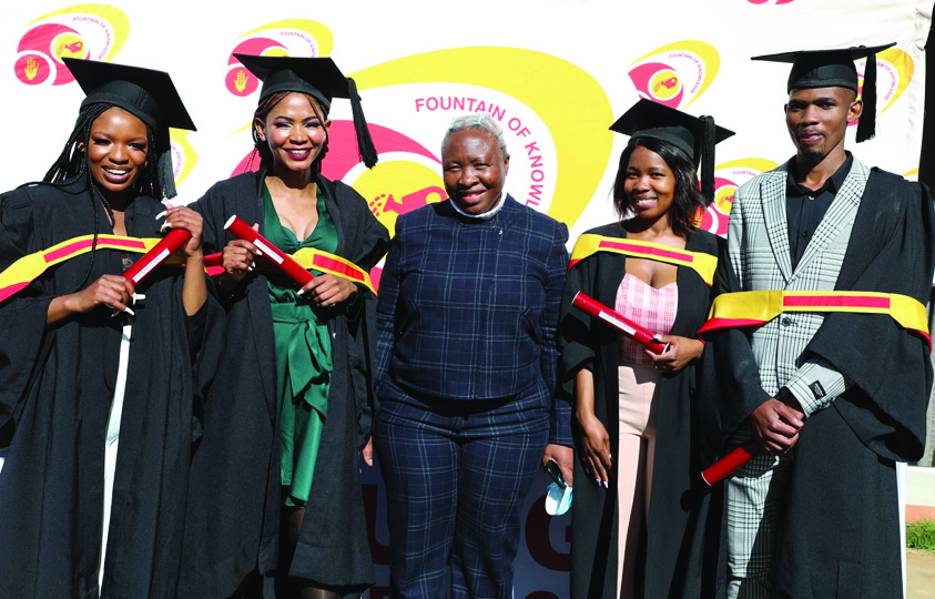 North West Agriculture and Rural Development MEC Desbo Mohono with four of the nine bursary beneficiaries at their graduation.