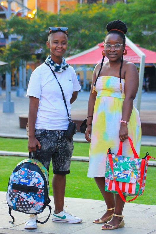 Phumudzo Muthanyi and Mbali Mokgosi of MicGalaw carrying the handbags they created from recycled materials.