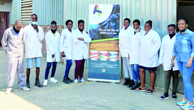 Cate Olifant (in blue) with the team members she has employed at Akani Paints.