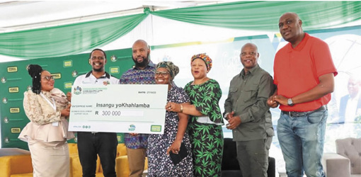 KZN MEC for Economic Development, Tourism and Environmental Affairs Siboniso Duma, MEC for Provincial Treasury Peggy Nkonyeni and MEC for Agriculture and Rural Development Super Zuma with Insangu yoKhahlamba representatives at the recent permit handover ceremony.