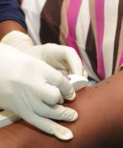Sister Rebecca Mokoma of Laudium Community Health Centre inserts the sub-dermal contraceptive device into the arm of Dipuo Moyeni. The device is one of the many contraceptive methods government is urging women to use to prevent unplanned pregnancies.