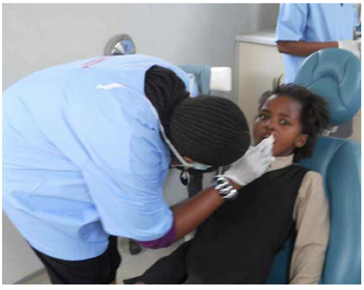 Photo caption: As part of efforts to improve primary health care, health teams having been visiting poor schools, offering much needed health services.