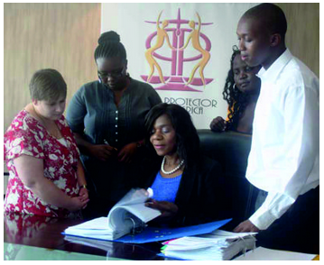 Trainee investigators Carina van Eeden (from left), Neo Mashigo, Bridgette Makama and Jeffrey Mphahlele have joined Public Protector Advocate Thuli Madonsela’s (seated) team to help deal with the workload.