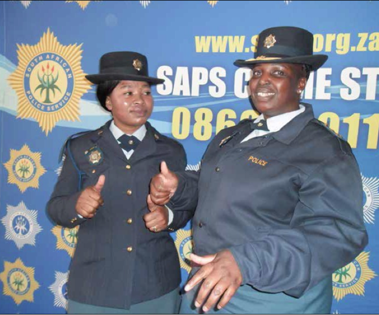 Constable Zanele Mtshali (left) and South African Police Service Nelspruit Policing Cluster commander Brigadier Dora Xaba demonstrate how sign language is used.